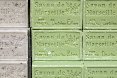 Nice, France - September 18, 2018: Background done by colorful soap cubes which are exposed on sale. Such a soaps are popular souvenirs from Provence, are known as Savon de Marseille.のeditorial素材