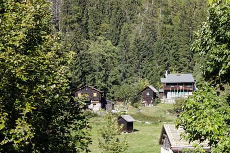 Rhone Alpes, France - September 26, 2018: There are farm buildings that were built on a flat, grassy...