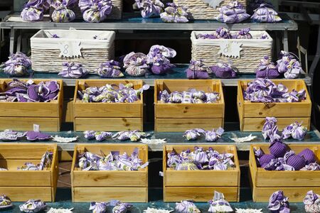 Nice, France - 18 September 2018: Traditional souvenirs are dried, fragrant lavender flowers packed in linen bags, which are here put up for sale at a market stall.のeditorial素材