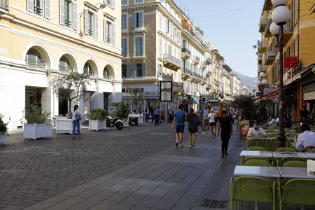 Nice, France - September 20, 2018: Street between tenement houses where there is an outdoor...