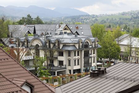 Zakopane, Poland - June 01, 2019: This four-storey building is a modern apartment building whose decorative facade can be seen here.のeditorial素材