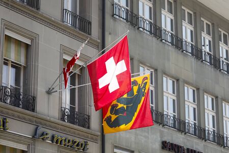 Bern, Switzerland - April 15, 2019: The flag of the canton of Valais is almost invisible, the flag...