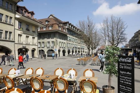 Bern, Switzerland - April 15, 2019: In the vicinity of the tenement houses there is a large square, visited by many tourists and residents. On a sunny day, there is an outdoor restaurant on the squareのeditorial素材