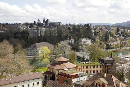 Bern, Switzerland - April 17, 2019: Cityscape with green areas which are almost in the middle of the city, together with trees and other plants, create a human-friendly landscape.のeditorial素材