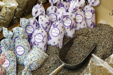 Nice, France - September 23, 2018: Dried lavender flowers are for sale loose and can be picked up with a small scoop. There are also lavender flowers closed in small fabric bags.のeditorial素材