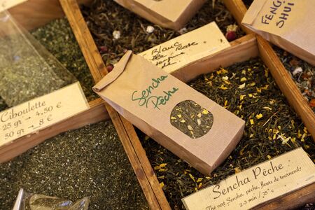 Nice, France - 18 September, 2018: Mixtures of tea with additives are available on the market in bulk quantities or are packed in small paper bags for retail consumers.のeditorial素材