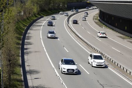 Bern, Switzerland - April 20, 2019: The traffic rushes along the highway through the city. At this place, the motorway turns lightly.のeditorial素材