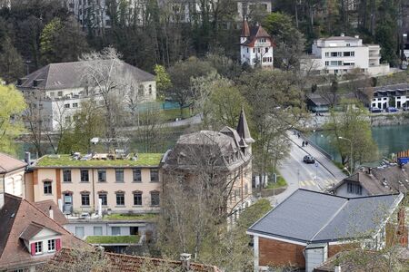 Bern, Switzerland - April 17, 2019: There are buildings near the Aare River. There are also a lot of trees and plants, which makes this place friendly to life.のeditorial素材