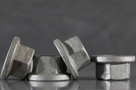 Screw nuts. These small industrial items are automotive parts and have been specially designed to be...
