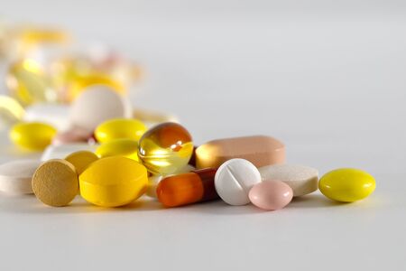 Large dosage of medicines. These varied tablets have various shapes and various colors.