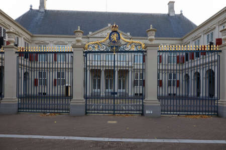 The Hague, The Netherlands - October 10, 2019: The Noordeinde Palace, one of the official residence of the Dutch monarchs. The royal coat of arms is on top of the entrance gate.のeditorial素材