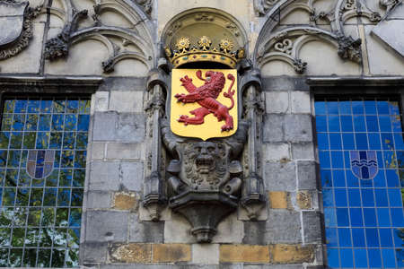 Delft, The Netherlands - October 10, 2019: Decorative coat-of-arms can be seen on the front facade of the building dating back to 1505.のeditorial素材