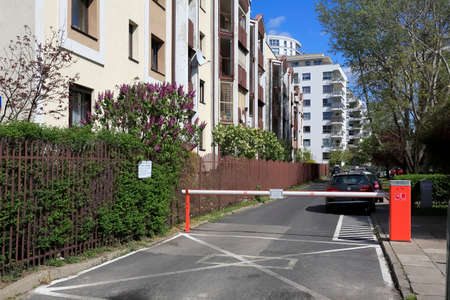 Warsaw, Poland - April 30, 2020: Behind automatically operated barrier modern residential buildings of housing estate locally known as Goclaw are visible.のeditorial素材