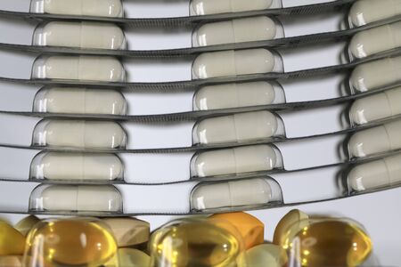 Blisters with pills, one on top of the other. There are other tablets as well.
