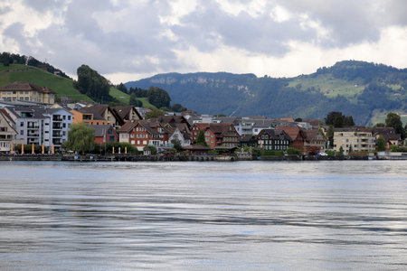 Beckenried, Switzerland - September 01, 2020: Residential houses located on the edge of Lake Lucerne are visible at a distance. The Lake of the four Cantons.のeditorial素材