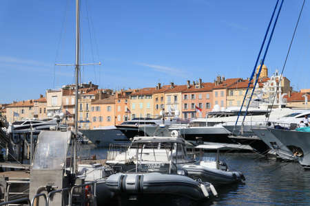 Saint-Tropez, France - July 08, 2009: Behind the marina there are houses located right on Mediterranean Sea. The place is one of the most visited and glamorous towns on the French Riviera.のeditorial素材