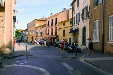 Saint-Tropez, France - July 08, 2009: A narrow street where traditional houses are located. In a...