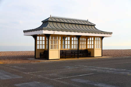 Worthing, United Kingdom - June 04, 2010: Wind shelter, made made according to a stylish design is placed at the edge of the promenade that runs along the coast.のeditorial素材