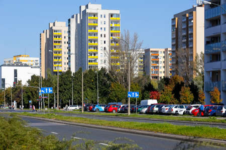 Warsaw, Poland - October 7, 2021: Residential buildings across the street. Many families live here, it is the Goclaw housing district visible here on a sunny day.のeditorial素材