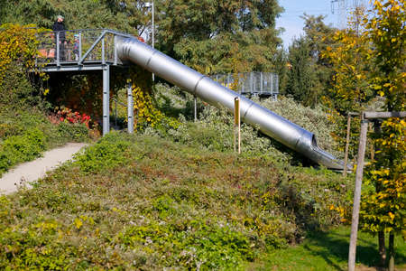 Warsaw, Poland - October 11, 2021: Sliding tube for children has been installed in a park in Goclaw district, Warsaw, Poland.のeditorial素材