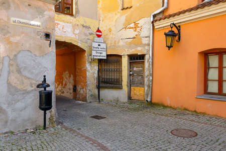 Lublin, Poland - September 11, 2021: The old tenement houses on the paved street are located in the old part of the city. There are no people or vehicles near these buildings nowのeditorial素材