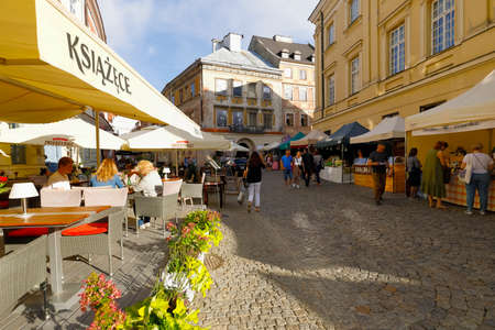 Lublin, Poland - September 10, 2021: Old Town Square with outdoor restaurants. There are stalls that offer a variety of cuisines and there are people visiting this eventのeditorial素材
