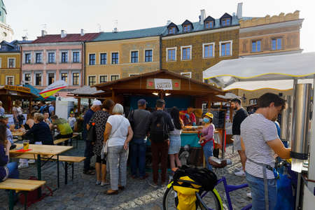 Lublin, Poland - September 11, 2021: During the culinary event, a lot of people gather around the stalls to enjoy the delicacies of various cuisines.のeditorial素材