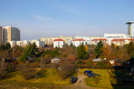 Warsaw, Poland - November 11, 2021: Here you can see the coexistence of the Goclaw housing estate with lush green areas. Autumn has already shown its colors on the treesのeditorial素材