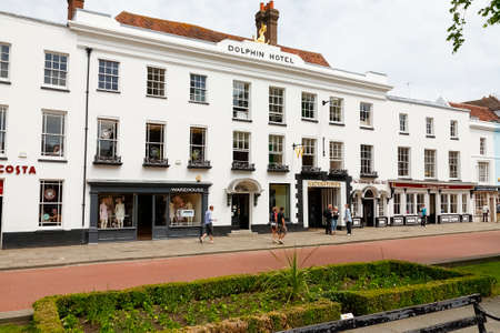 Chichester, England, UK - June 6, 2010: The shop windows in the building with a white facade are...
