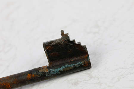 One old, badly worn key for a lock or padlock is very worn and seems to be useless anymoreの写真素材