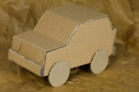 Car model made of cardboard. Recycled packaging material has been used to handcraft this car model.の写真素材
