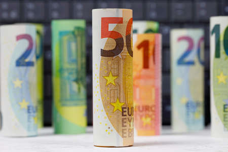 There are European Union banknotes placed next to each other. Euro banknotes are not made of paper, but of pure cotton fiber to improve their durability. EUR currency.の写真素材