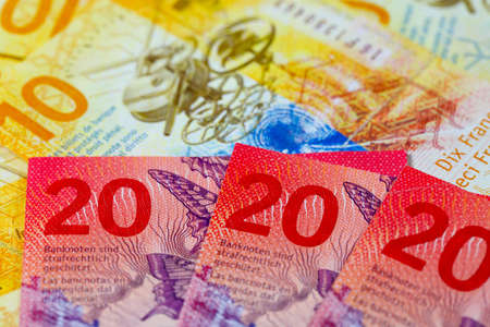 A group of Swiss franc banknotes of different denominations, placed next to each other. CHF paper money, edition of Swiss banknotes, issued from April 2016 to 2019の写真素材