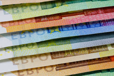 There are European Union banknotes placed next to each other. Euro banknotes are not made of paper, but of pure cotton fiber to improve their durability. EUR currencyの写真素材