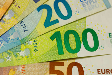 There are European Union banknotes placed next to each other. Euro banknotes are not made of paper, but of pure cotton fiber to improve their durability. EUR currency.の写真素材