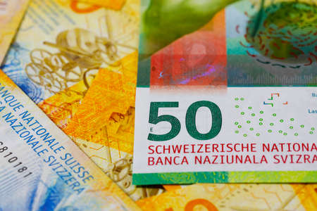 A group of various Swiss franc banknotes of different denominations, placed next to each other. CHF paper money, edition of Swiss banknotes, issued from April 2016 to 2019の写真素材