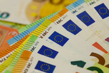 There are European Union banknotes placed next to each other. Euro banknotes are not made of paper, but of pure cotton fiber to improve their durability. EUR currency.の写真素材