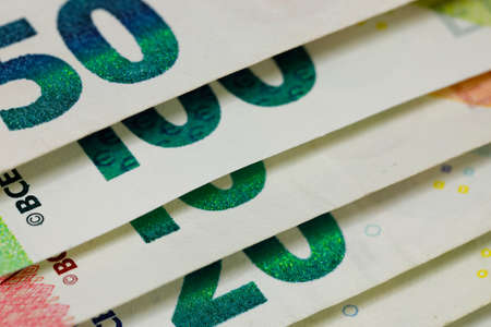 There are European Union banknotes placed next to each other. Euro banknotes are not made of paper, but of pure cotton fiber to improve their durability. EUR currency.の写真素材