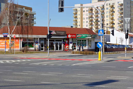 Warsaw, Poland - March 1, 2022: View of the streets and architecture of the city. Small stores and large apartment buildings located in the Goclaw housing estate, in the Praga Poludnie district.のeditorial素材
