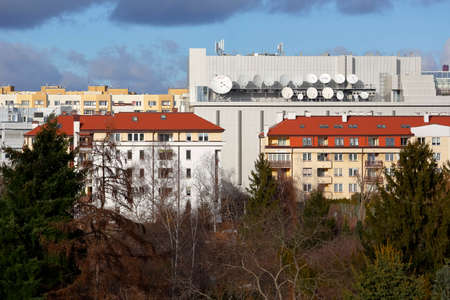 Warsaw, Poland - January 31, 2022: Residential buildings located in the Goclaw housing estate, in the Praga Poludnie district. There are many satellite dishes on the roof of one of the buildingsのeditorial素材