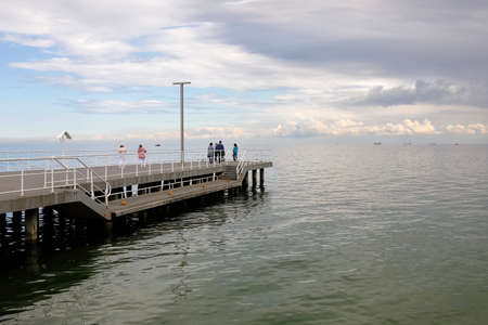 Gdynia, Poland - May 29, 2022: There is a small concrete pier on the waters of Gdansk Bay. There are people on this pierのeditorial素材