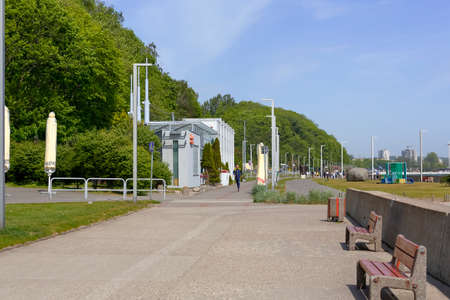 Gdynia, Poland - May 24, 2022: The wide promenade that runs along the coast of the Bay of Gdansk has a wide sidewalk, bicycle path, lots of greenery, various restaurants, and above all beautiful viewsのeditorial素材