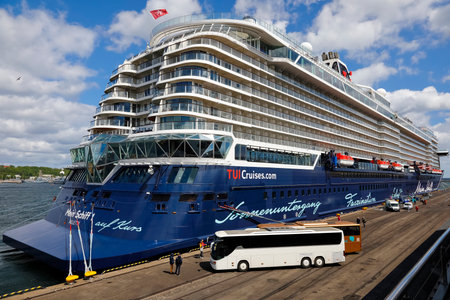 Gdynia, Poland - May 27, 2022: A cruise ship named Mein Schiff 1 stopped in the port of Gdynia on a sunny day. This modern ship was put into operation in 2018 and its length is almost 316 meters.のeditorial素材