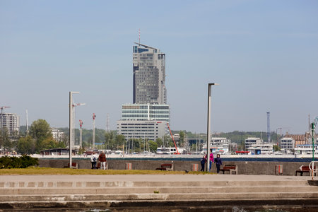 Gdynia, Poland - May 24, 2022: The southern pier of the port with its modern buildings is visible in the distance, just behind the promenade running along the Gulf of Gdanskのeditorial素材