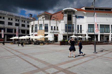 Sopot, Poland - May 31, 2022: Modern buildings on the famous boulevard in the immediate vicinity of the famous pier. Dark clouds are visible in the sky before the oncoming stormのeditorial素材