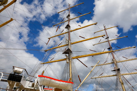 Gdynia, Poland - May 27, 2022: Two of the three masts of tall-ship named Dar Mlodziezy seen up close. This is the Polish training sailing ship, frigate type built in the Gdansk Shipyard in 1982.のeditorial素材