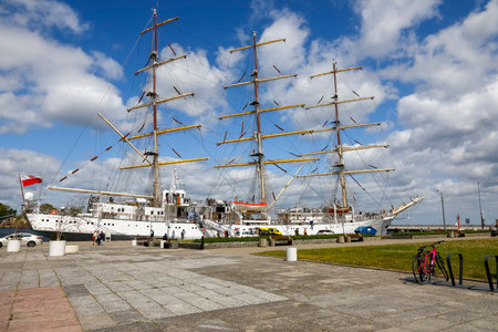 Gdynia, Poland - May 27, 2022: Dar Mlodziezy moored at the wharf in the port. This is a three-masted Polish training sailing ship, frigate type built in the Gdansk Shipyard in 1982のeditorial素材