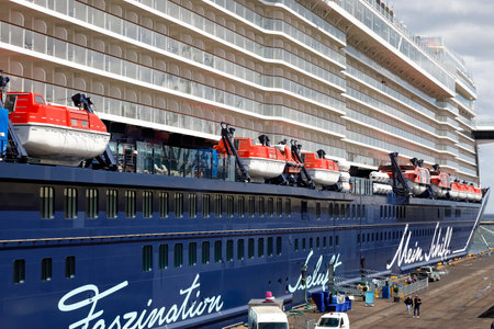 Gdynia, Poland - May 27, 2022: A cruise ship named Mein Schiff 1 stopped in the port of Gdynia on a sunny day. This modern ship was put into operation in 2018 and its length is almost 316 meters.のeditorial素材