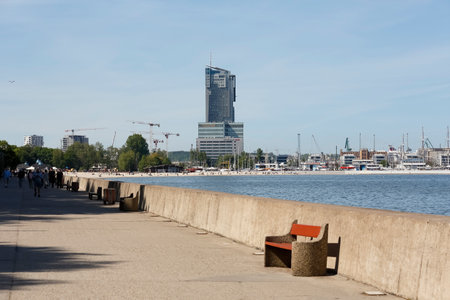 Gdynia, Poland - May 23, 2022: Behind the gulf the southern pier of the port you can see in the distance. There are also modern tall buildings thereのeditorial素材