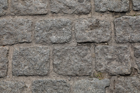 The cobblestone surfaces shown up close it is a part of a pavement or roadway made in the traditional wayの写真素材